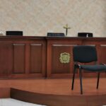 Prisión preventiva para un agente migratorio y un chofer que cobraron sobornos a migrantes indocumentados en Montecristi